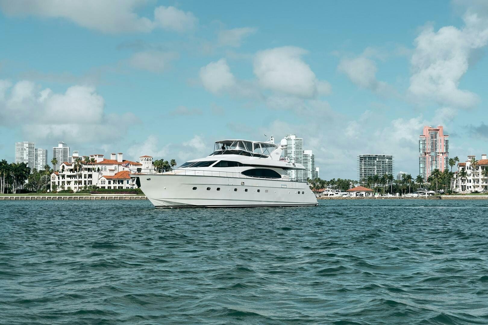 a white boat on the water aboard SUN ADVENTURES Yacht for Sale