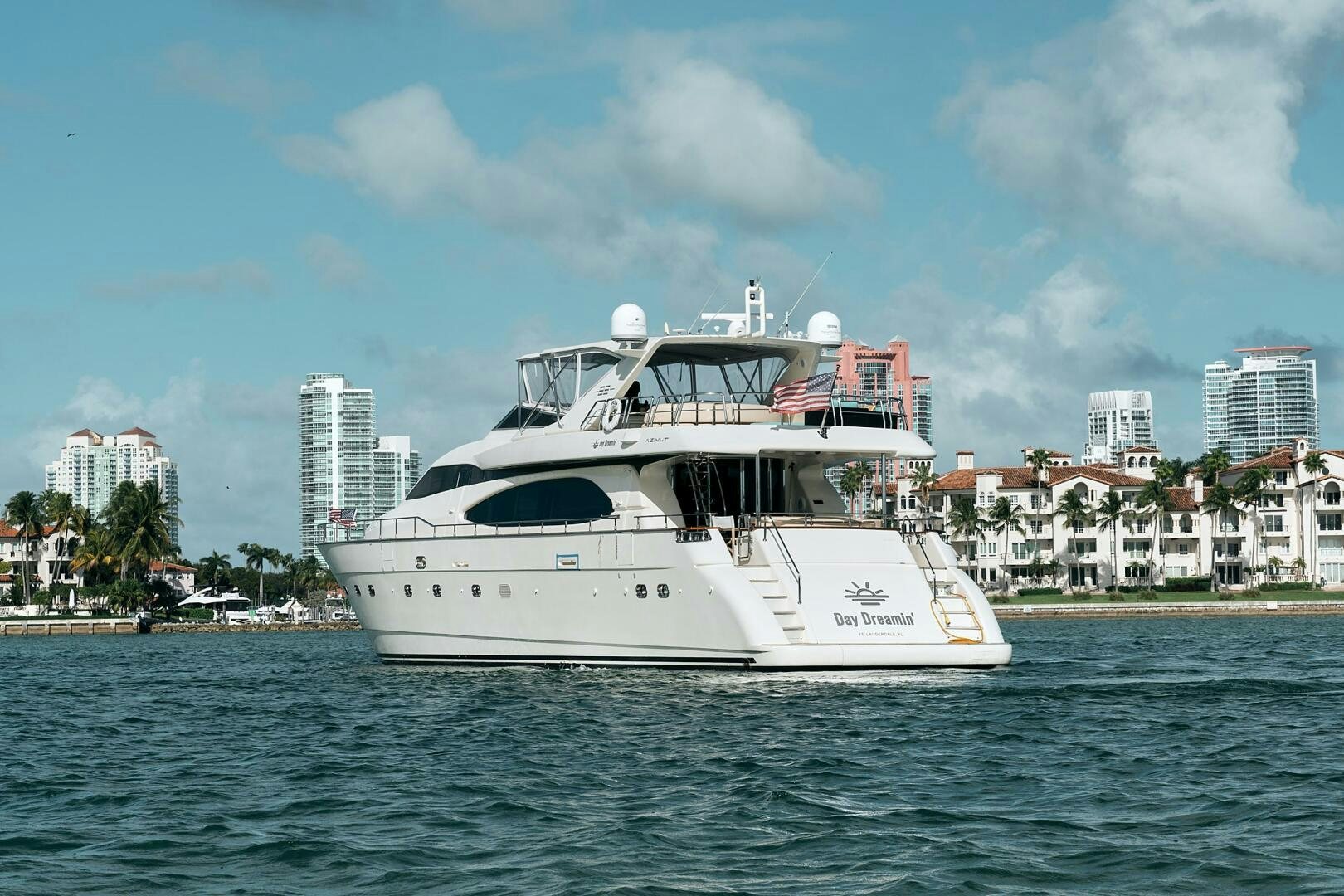 a white boat on the water aboard SUN ADVENTURES Yacht for Sale