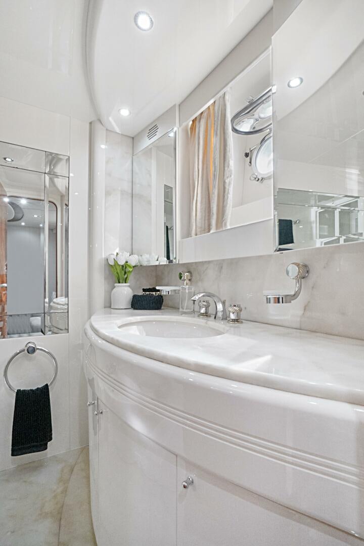 a bathroom with a large mirror aboard SUN ADVENTURES Yacht for Sale
