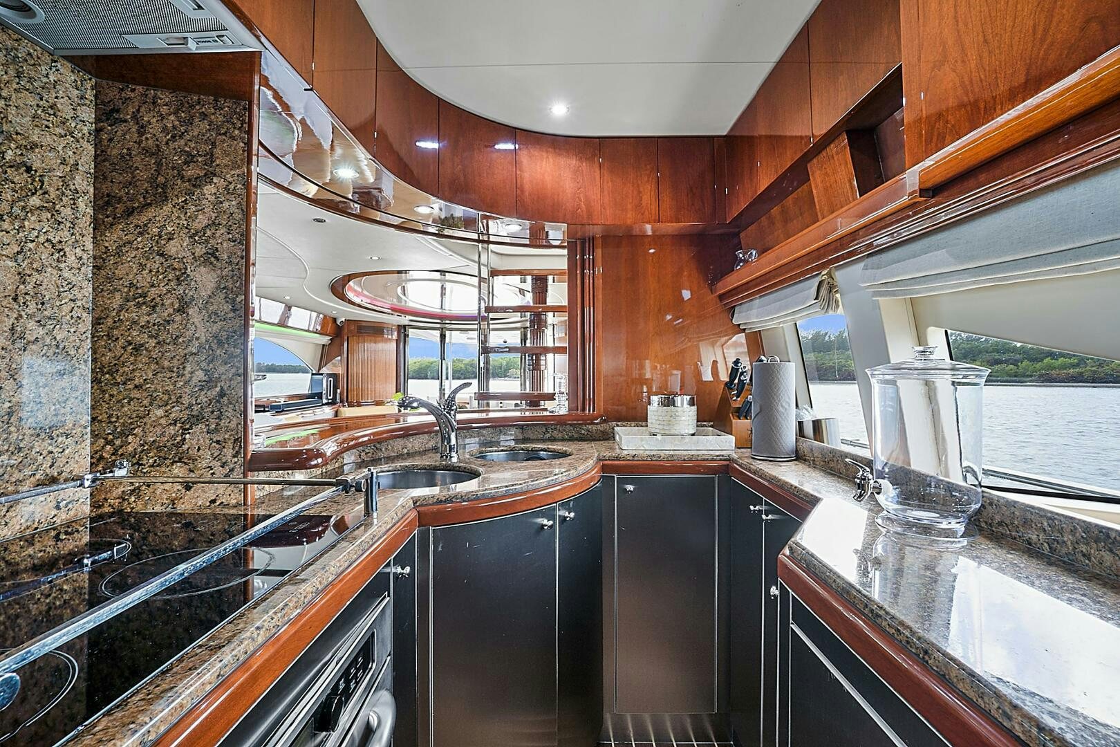 a kitchen with a stone wall aboard SUN ADVENTURES Yacht for Sale