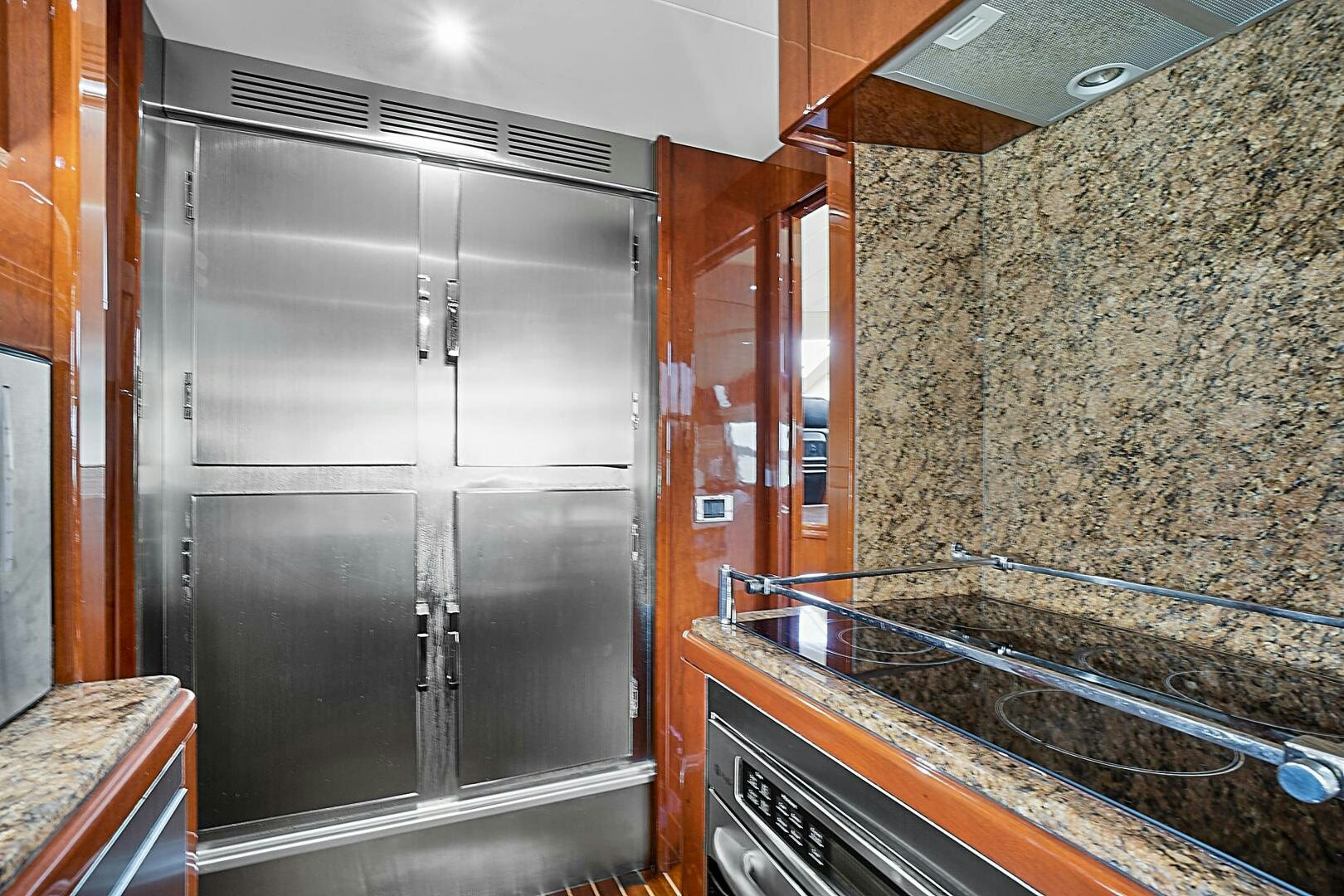 a kitchen with a large glass shower aboard SUN ADVENTURES Yacht for Sale