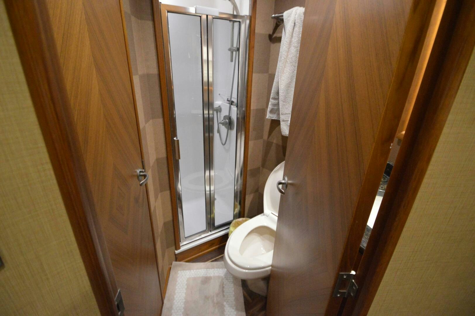 a bathroom with a glass shower aboard LOW PROFILE Yacht for Sale