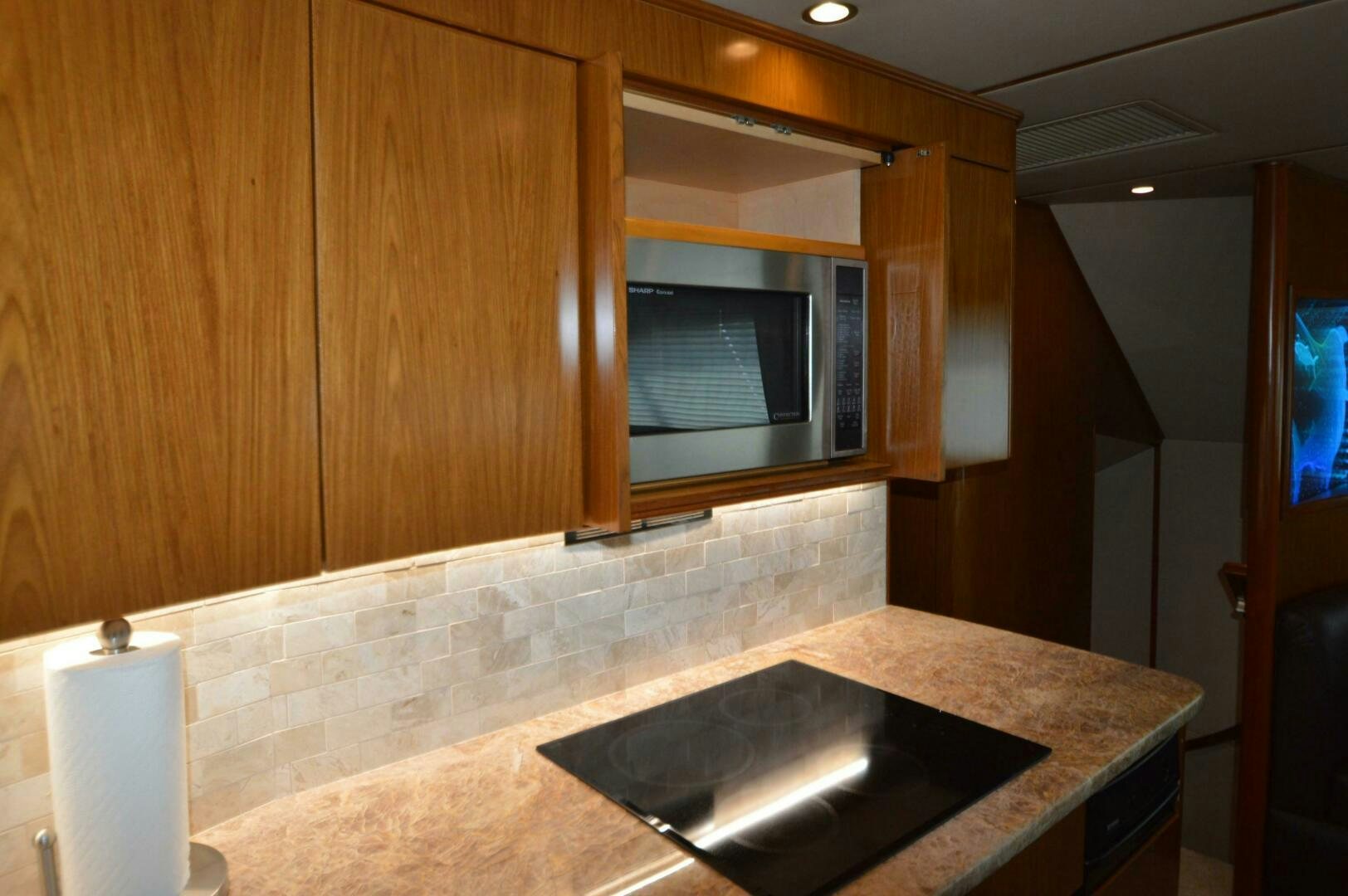 a kitchen with a black sink aboard LOW PROFILE Yacht for Sale