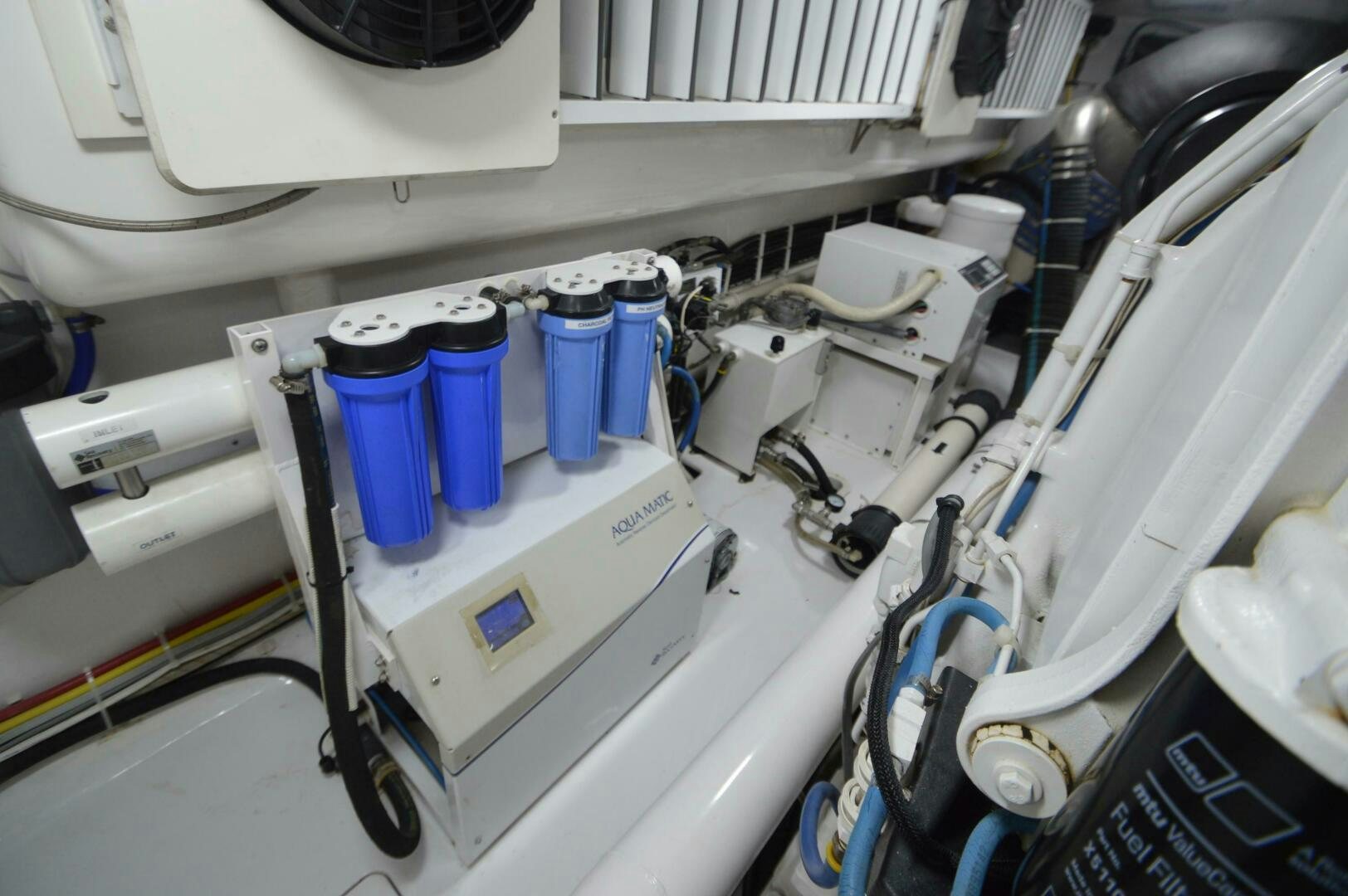a white machine with blue tubes aboard LOW PROFILE Yacht for Sale