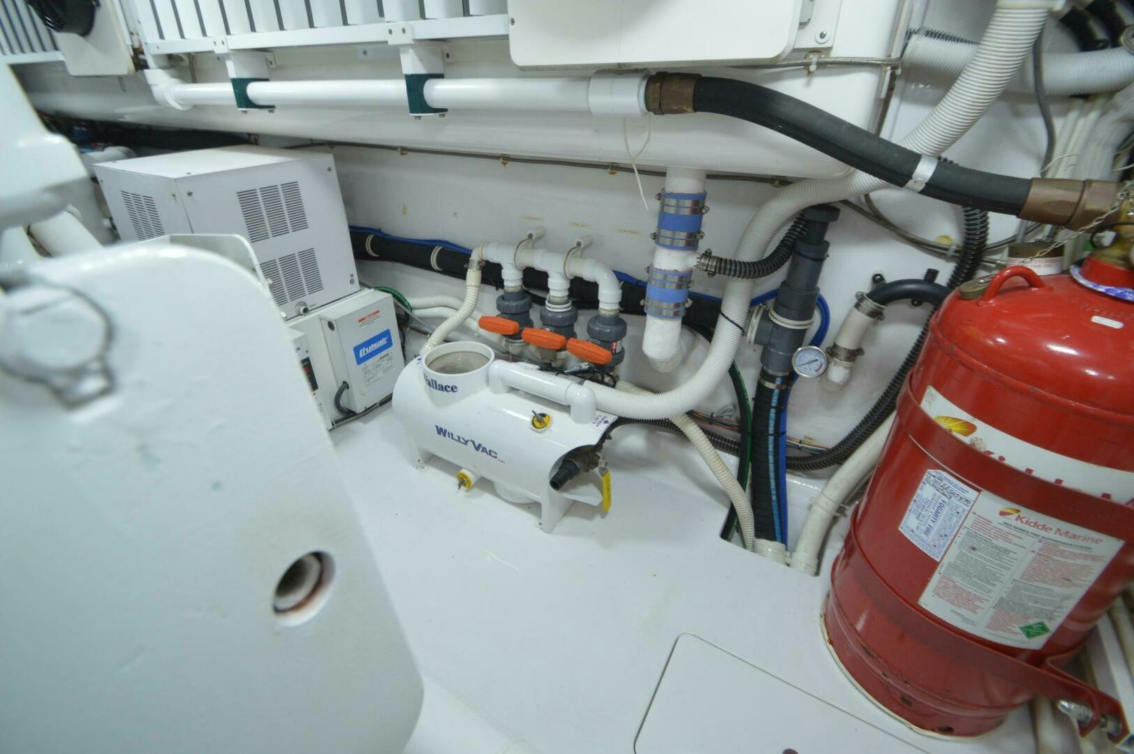 a red and white tool on a white surface aboard LOW PROFILE Yacht for Sale