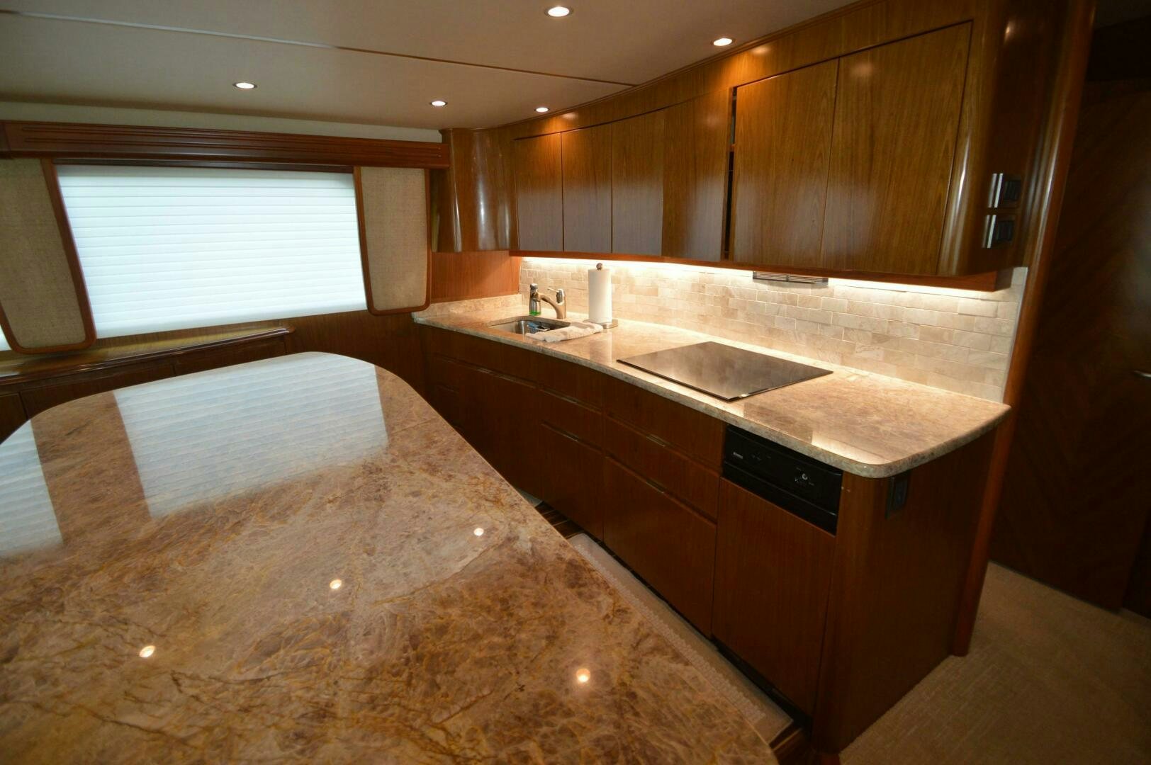 a large bathroom with a large marble countertop aboard LOW PROFILE Yacht for Sale