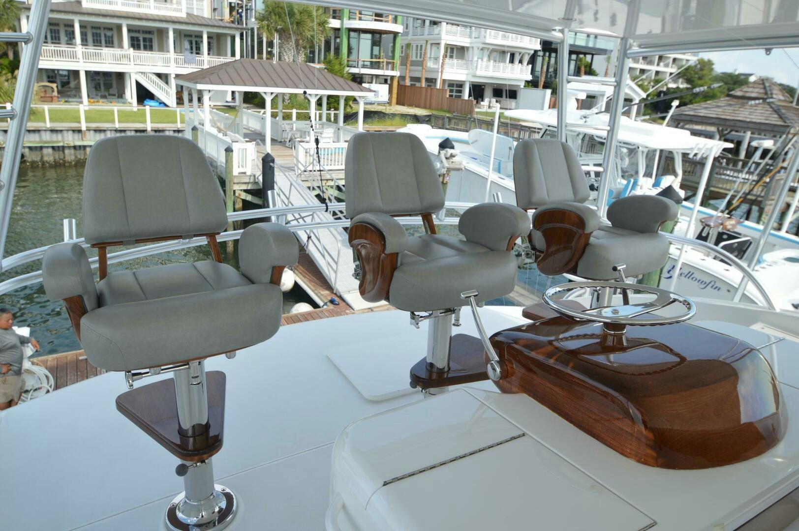 a table with chairs and a plate of food on it aboard LOW PROFILE Yacht for Sale