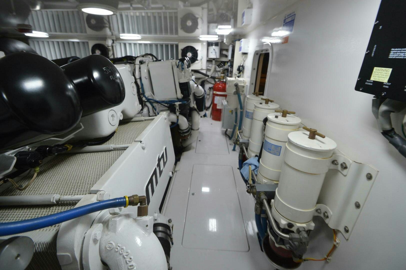 a room full of white and black machinery aboard LOW PROFILE Yacht for Sale