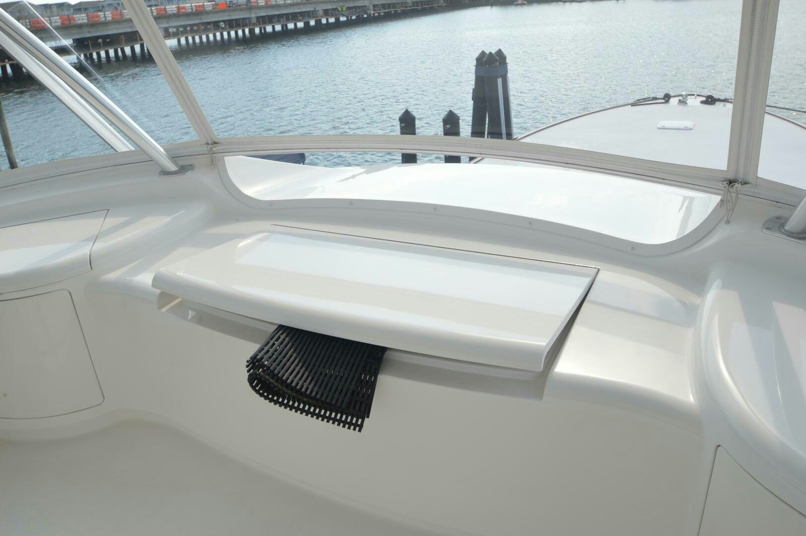 a white car with a black seat aboard LOW PROFILE Yacht for Sale
