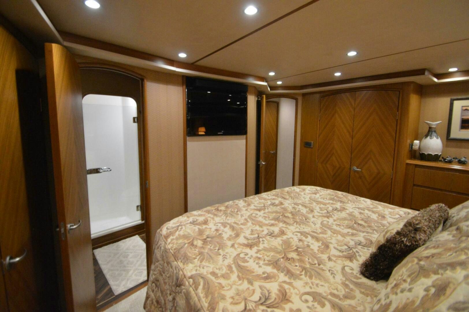 a bedroom with a large bed aboard LOW PROFILE Yacht for Sale
