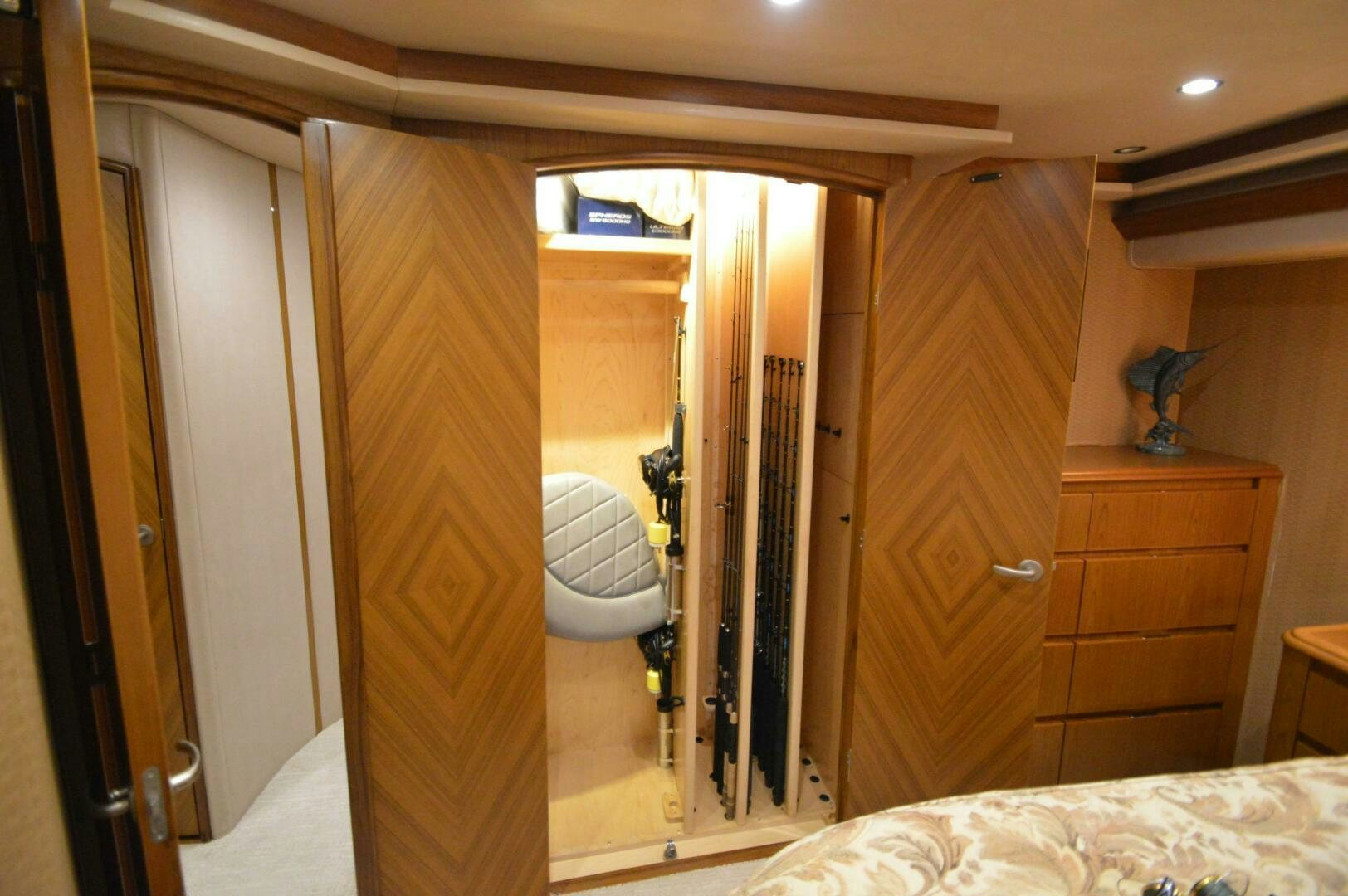 a bathroom with a wood door aboard LOW PROFILE Yacht for Sale