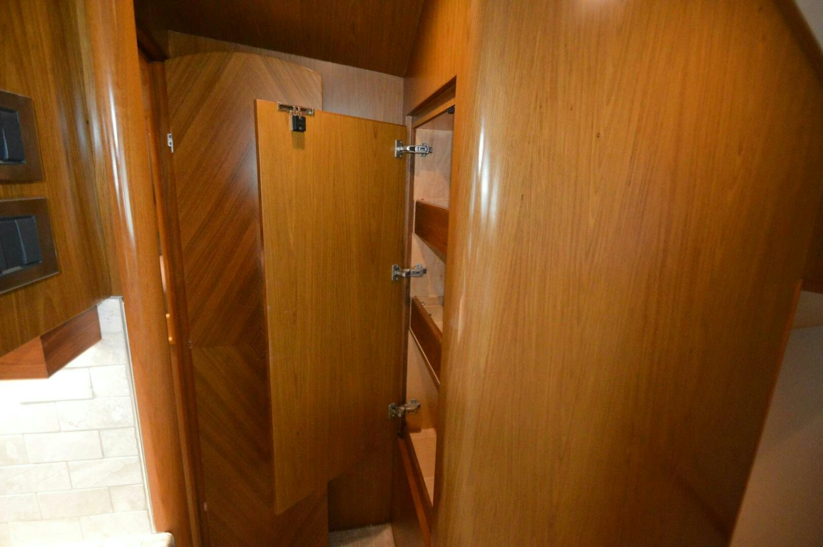a wooden closet with a door aboard LOW PROFILE Yacht for Sale
