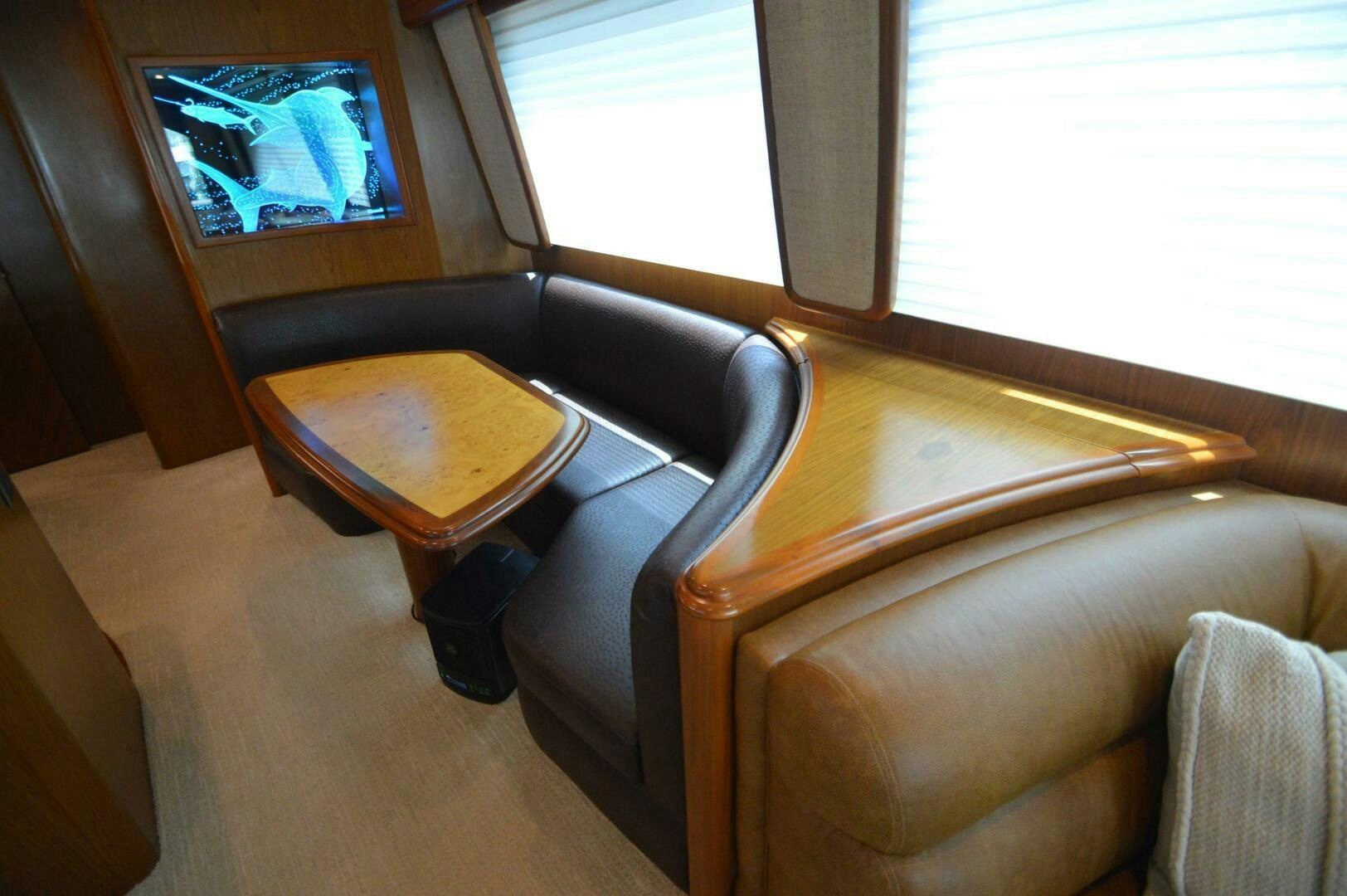 a room with a couch and a television aboard LOW PROFILE Yacht for Sale