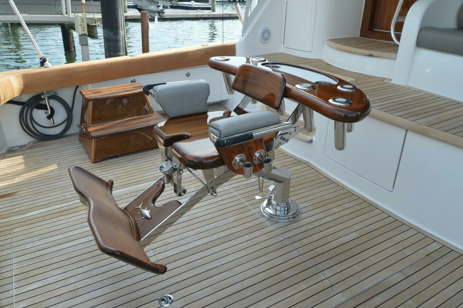 a wooden chair on a deck aboard LOW PROFILE Yacht for Sale
