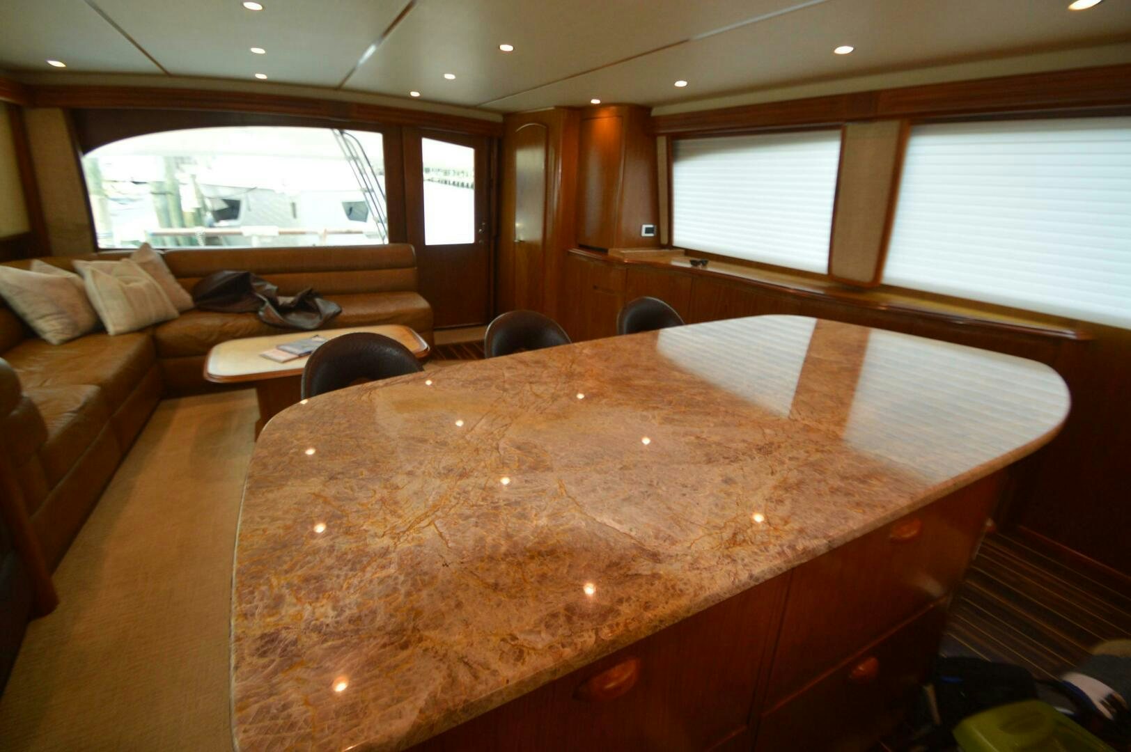 a large wooden table in a room aboard LOW PROFILE Yacht for Sale