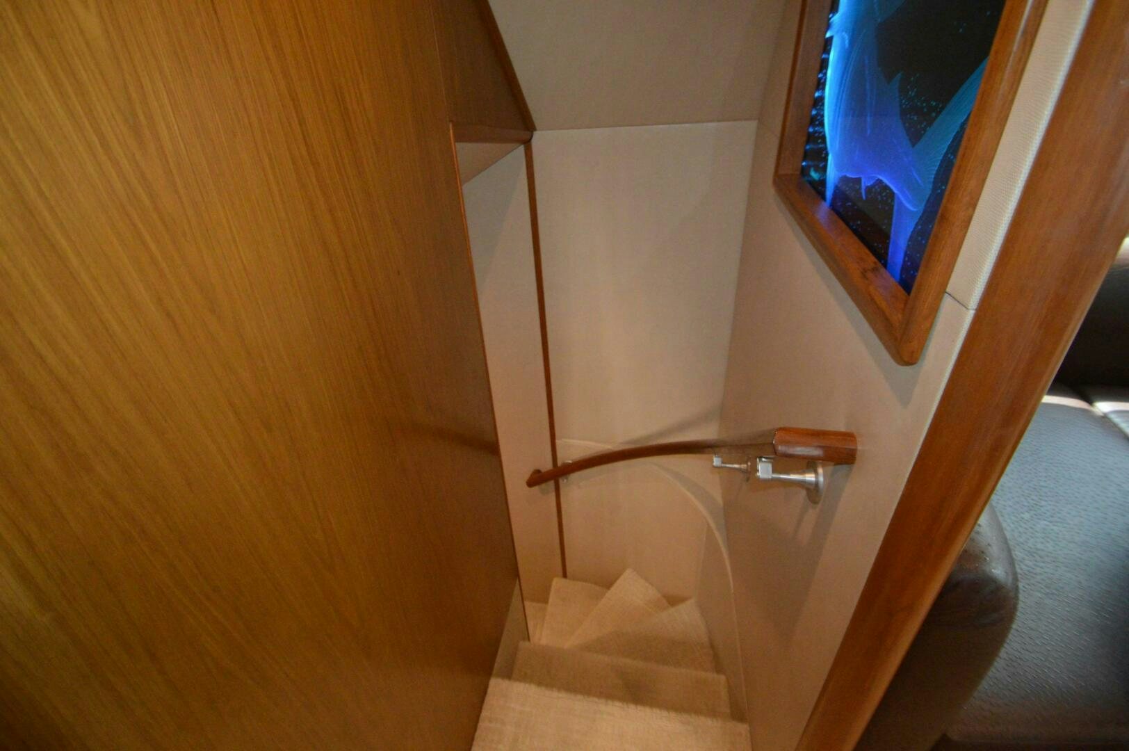 a wooden staircase with a window aboard LOW PROFILE Yacht for Sale