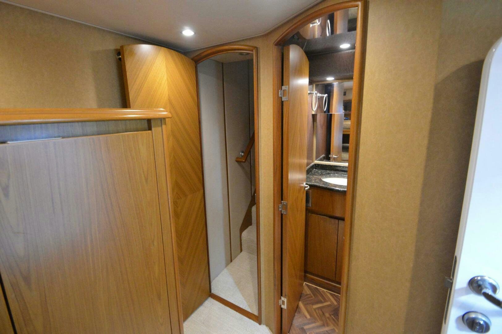 a room with wooden cabinets aboard LOW PROFILE Yacht for Sale