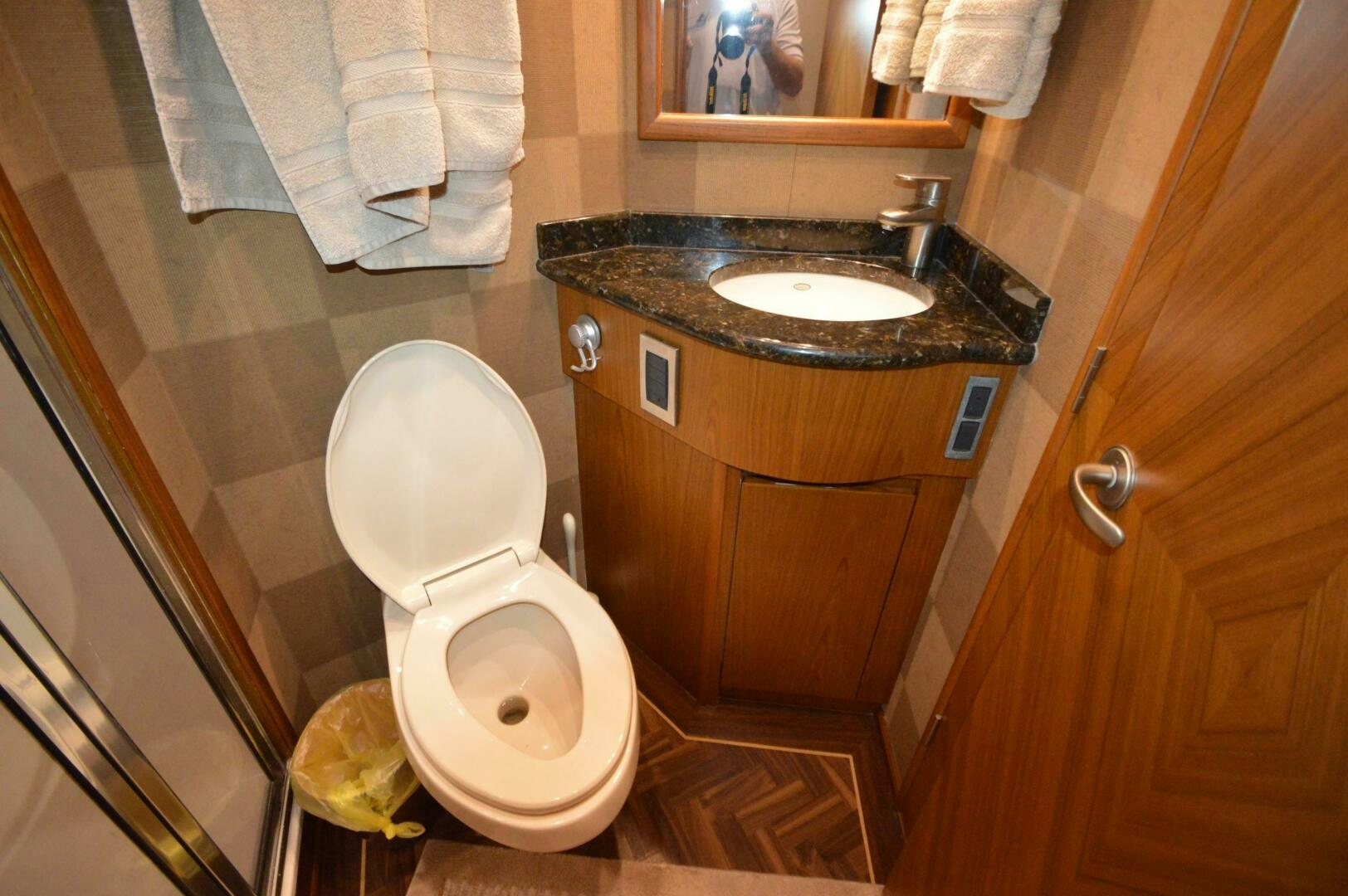 a bathroom with a toilet and sink aboard LOW PROFILE Yacht for Sale