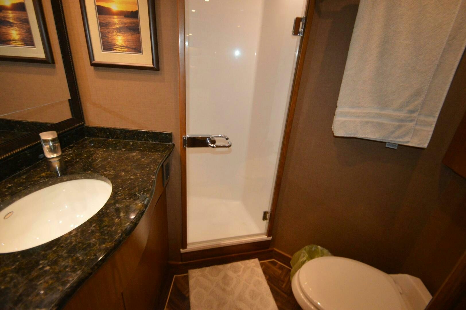 a bathroom with a sink and toilet aboard LOW PROFILE Yacht for Sale