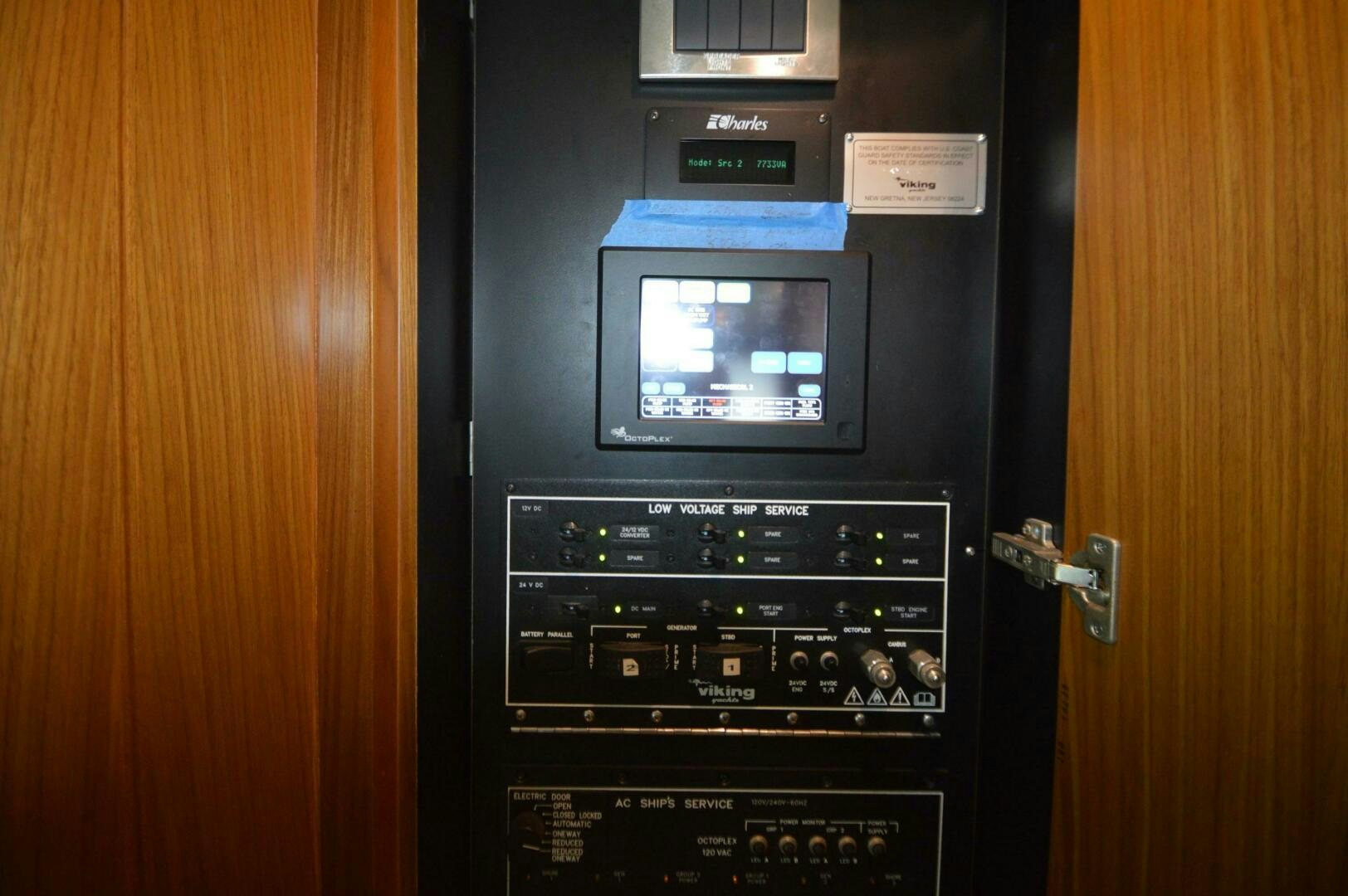 a black machine with a screen aboard LOW PROFILE Yacht for Sale