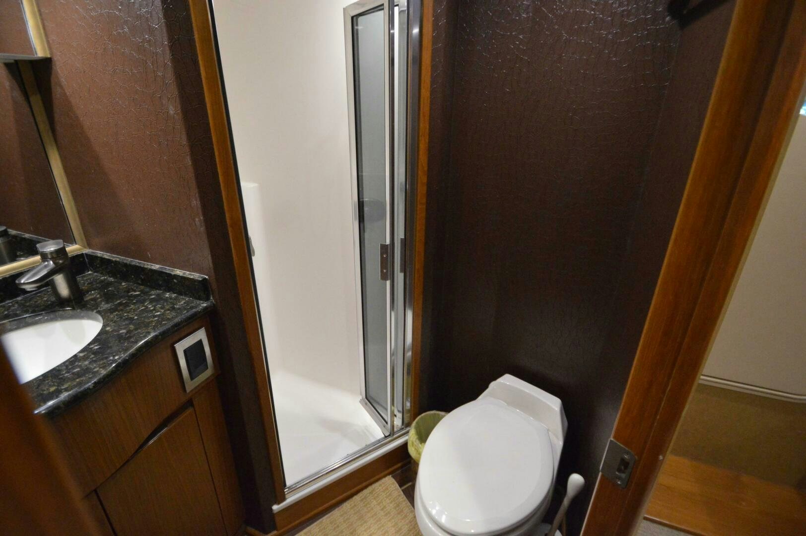 a bathroom with a toilet and sink aboard LOW PROFILE Yacht for Sale