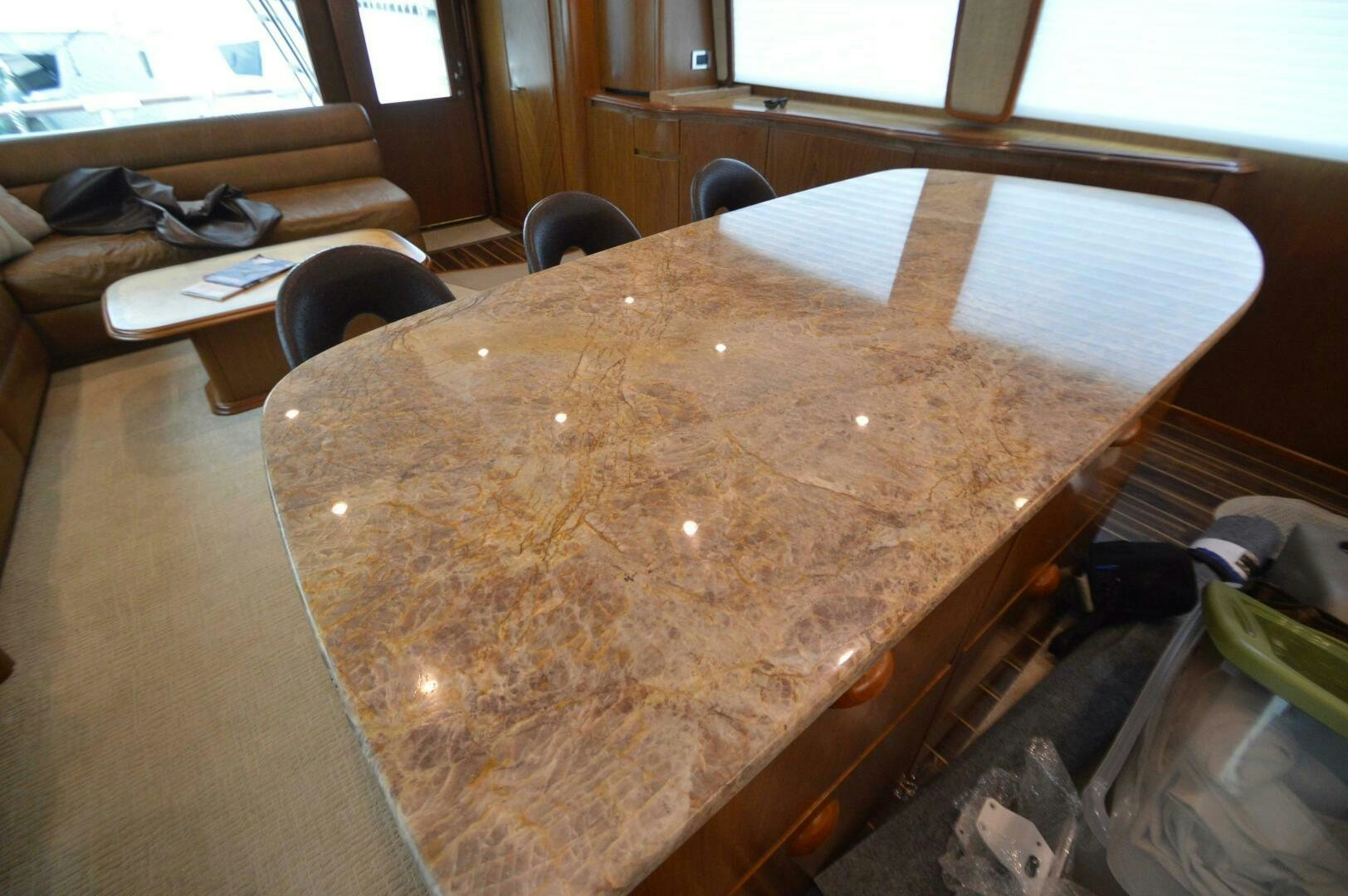 a wooden table with a large wooden board on it aboard LOW PROFILE Yacht for Sale