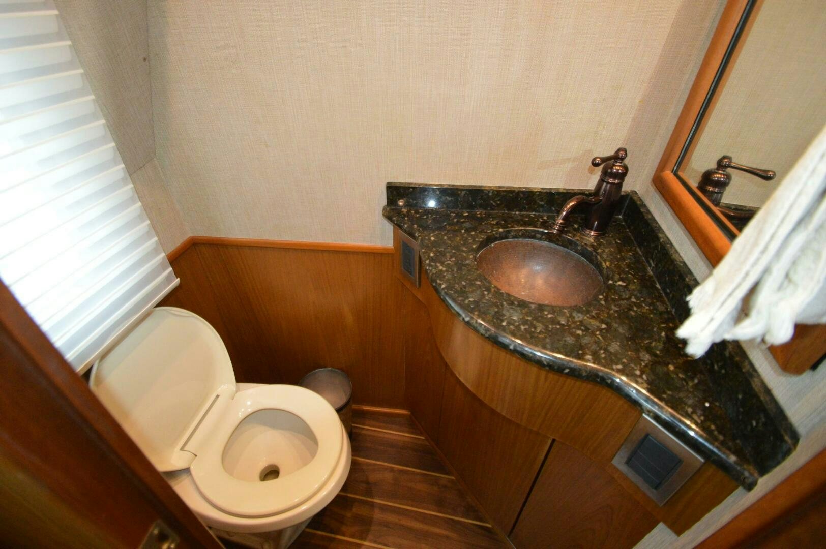 a bathroom with a sink and a toilet aboard LOW PROFILE Yacht for Sale