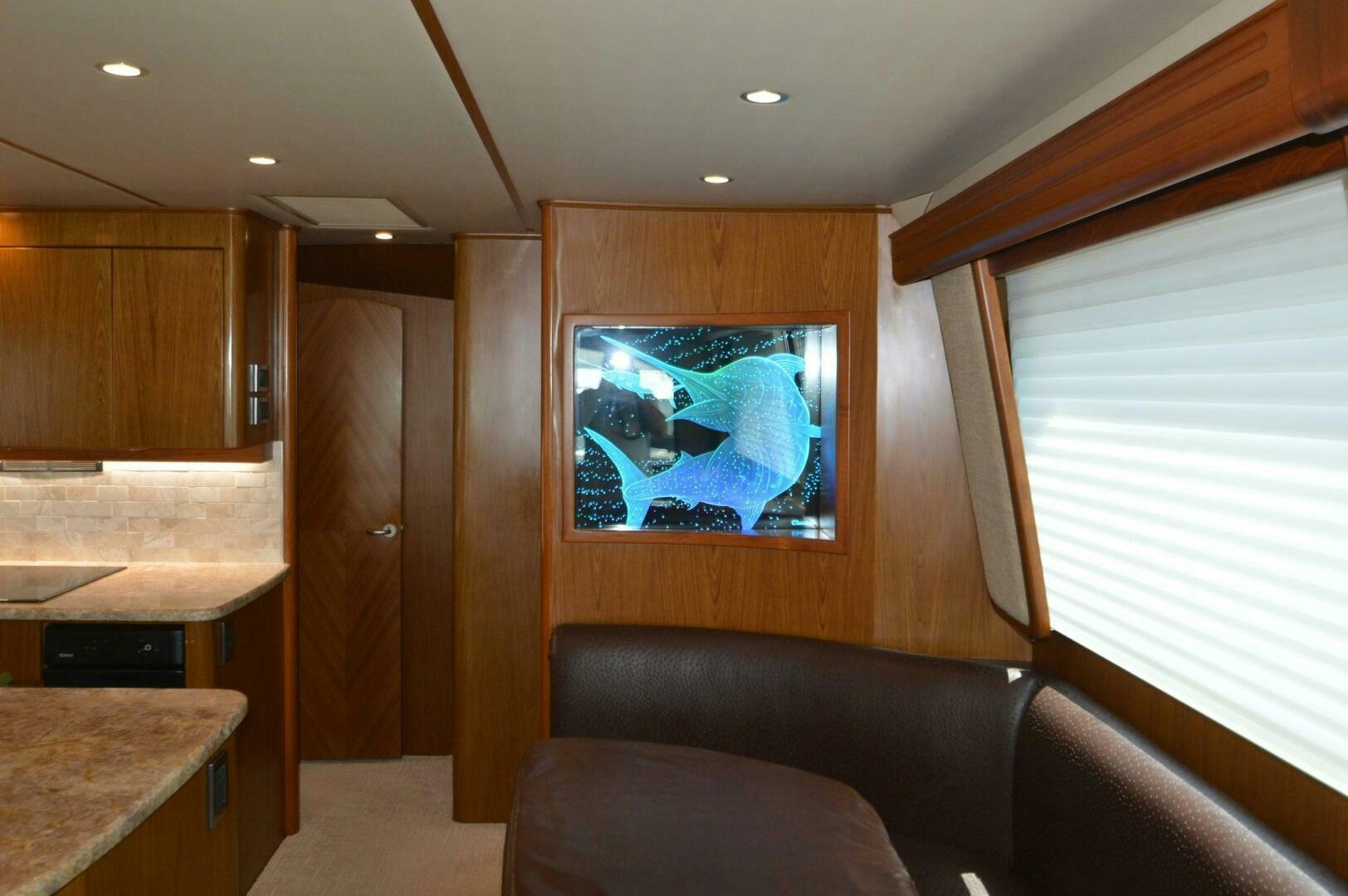 a living room with a painting on the wall aboard LOW PROFILE Yacht for Sale