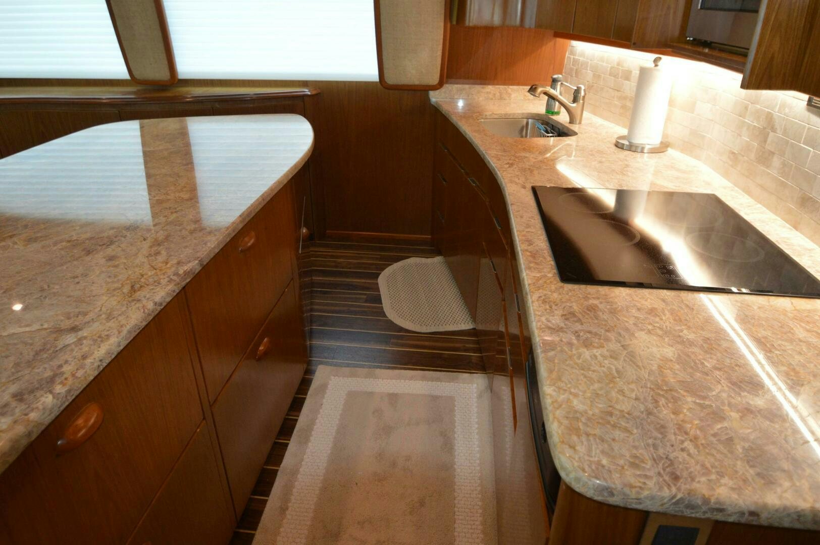 a bathroom with a countertop sink and a bathtub aboard LOW PROFILE Yacht for Sale