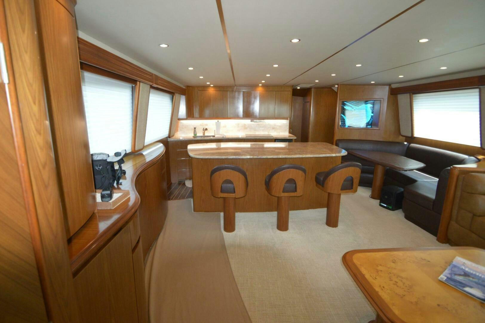 a room with a table and chairs aboard LOW PROFILE Yacht for Sale