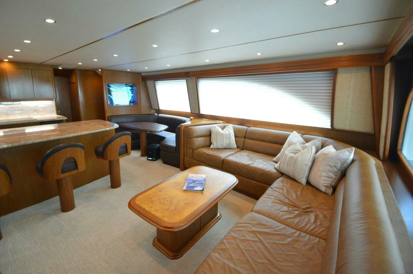 a room with a couch and a table aboard LOW PROFILE Yacht for Sale