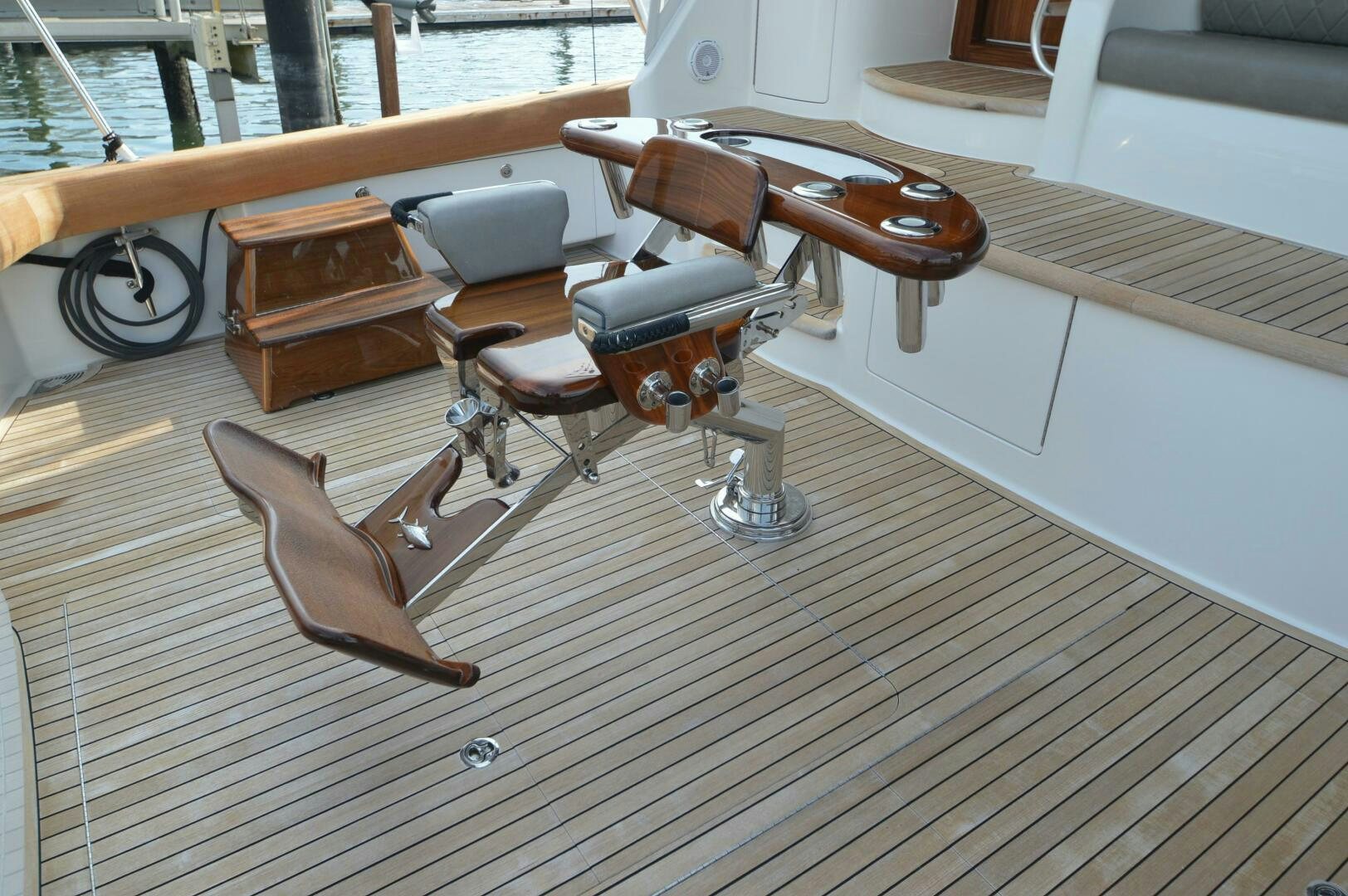 a wooden boat on a deck aboard LOW PROFILE Yacht for Sale