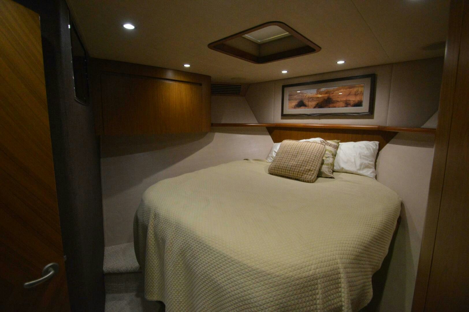 a bed in a room aboard LOW PROFILE Yacht for Sale