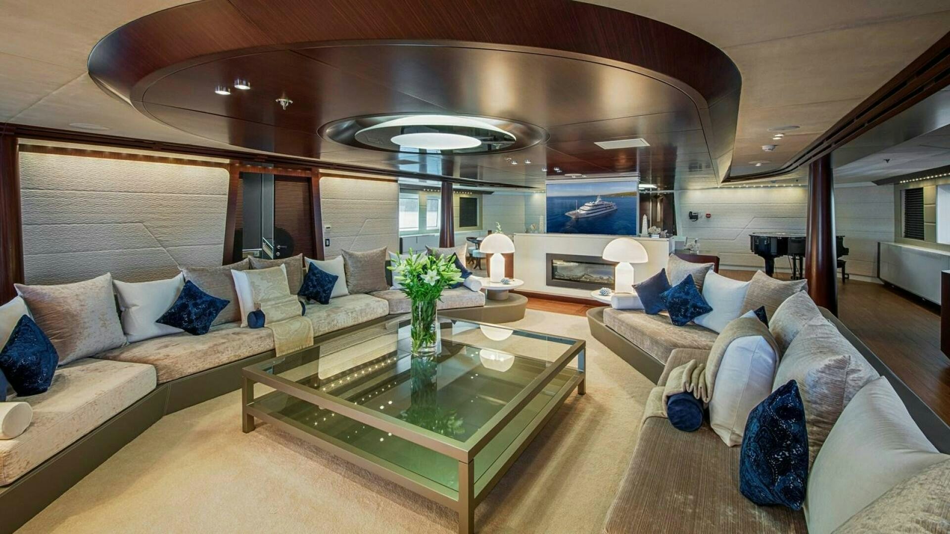 a living room with a large table aboard KATINA Yacht for Sale