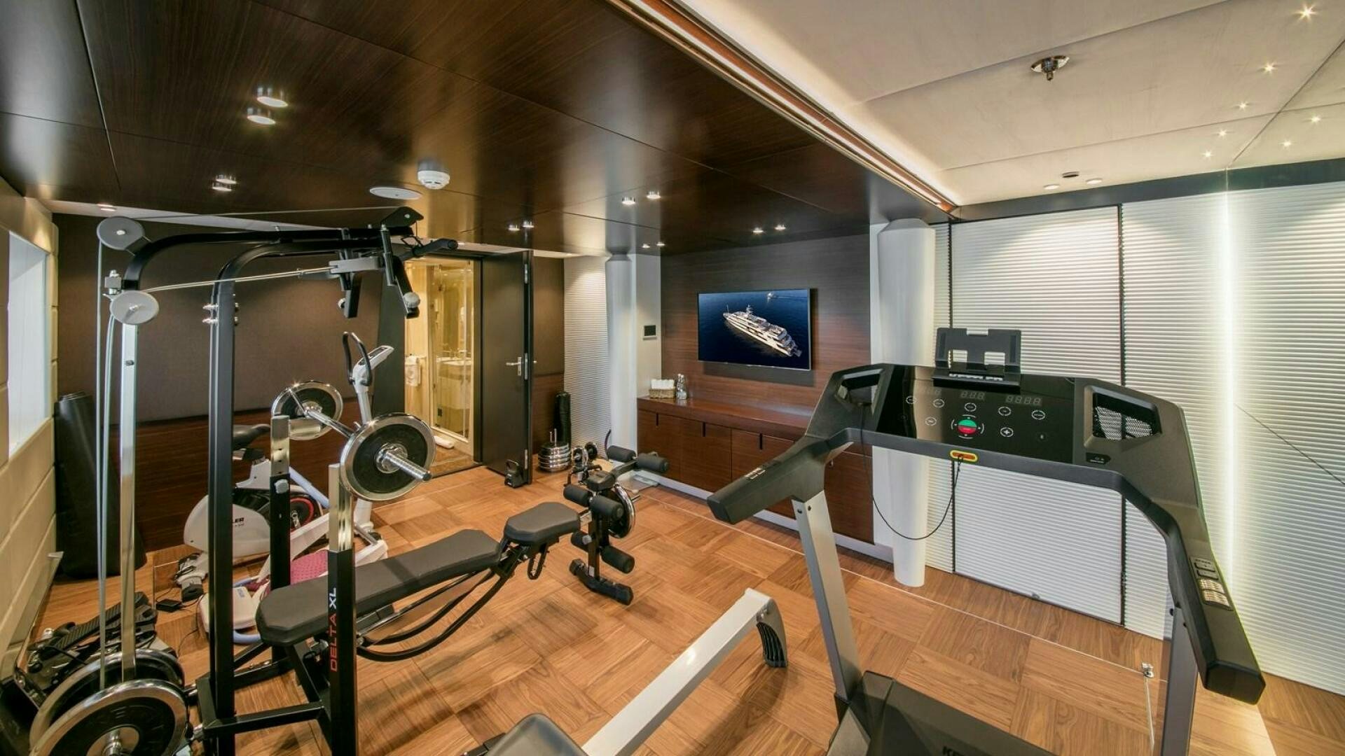 a room with equipment and a screen aboard KATINA Yacht for Sale