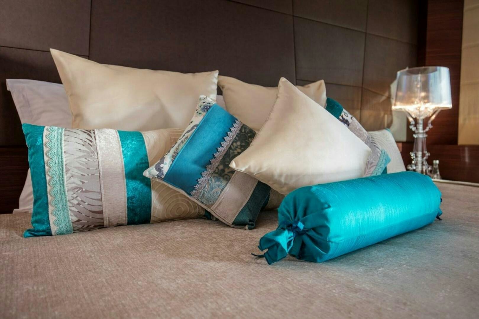 a bed with pillows and pillows aboard KATINA Yacht for Sale