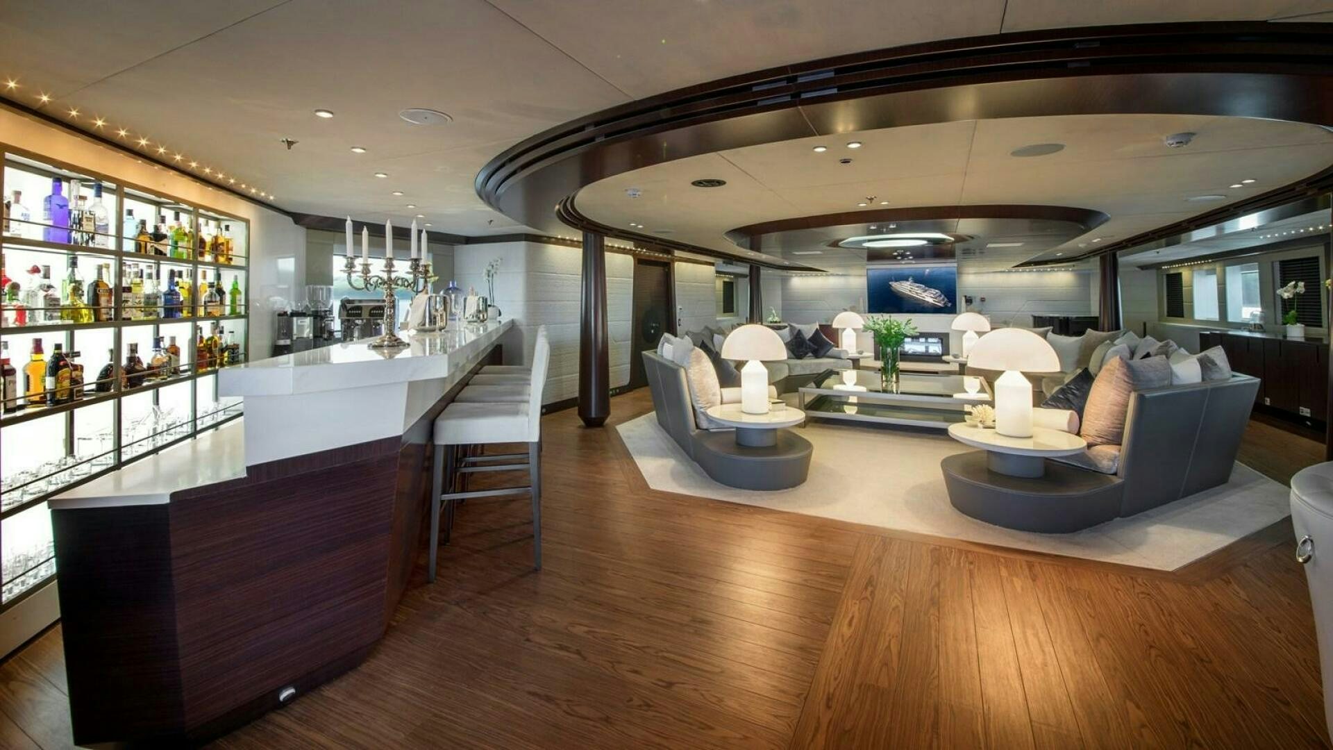 a living room with a large wood floor aboard KATINA Yacht for Sale