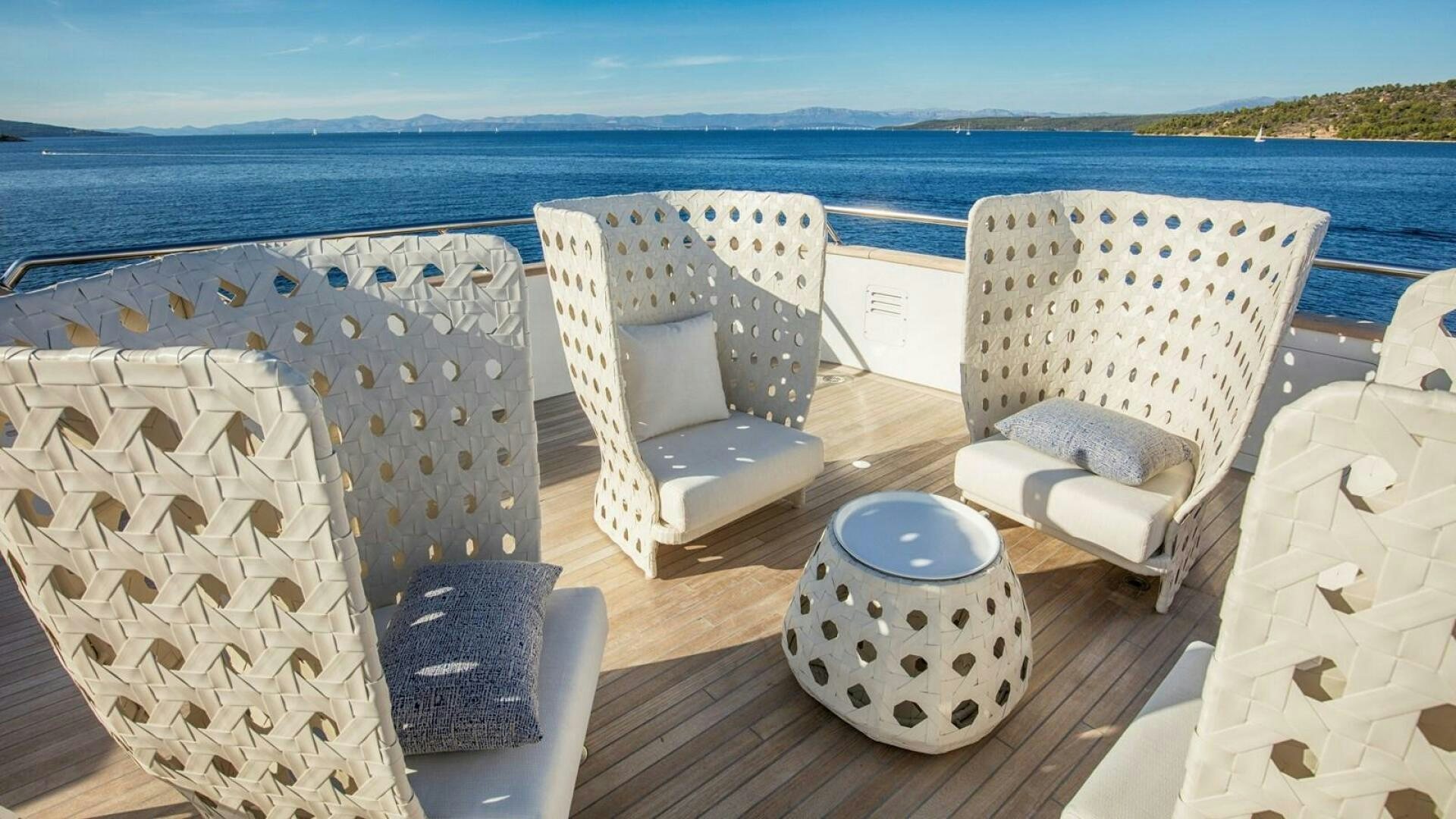 a table with chairs on it aboard KATINA Yacht for Sale