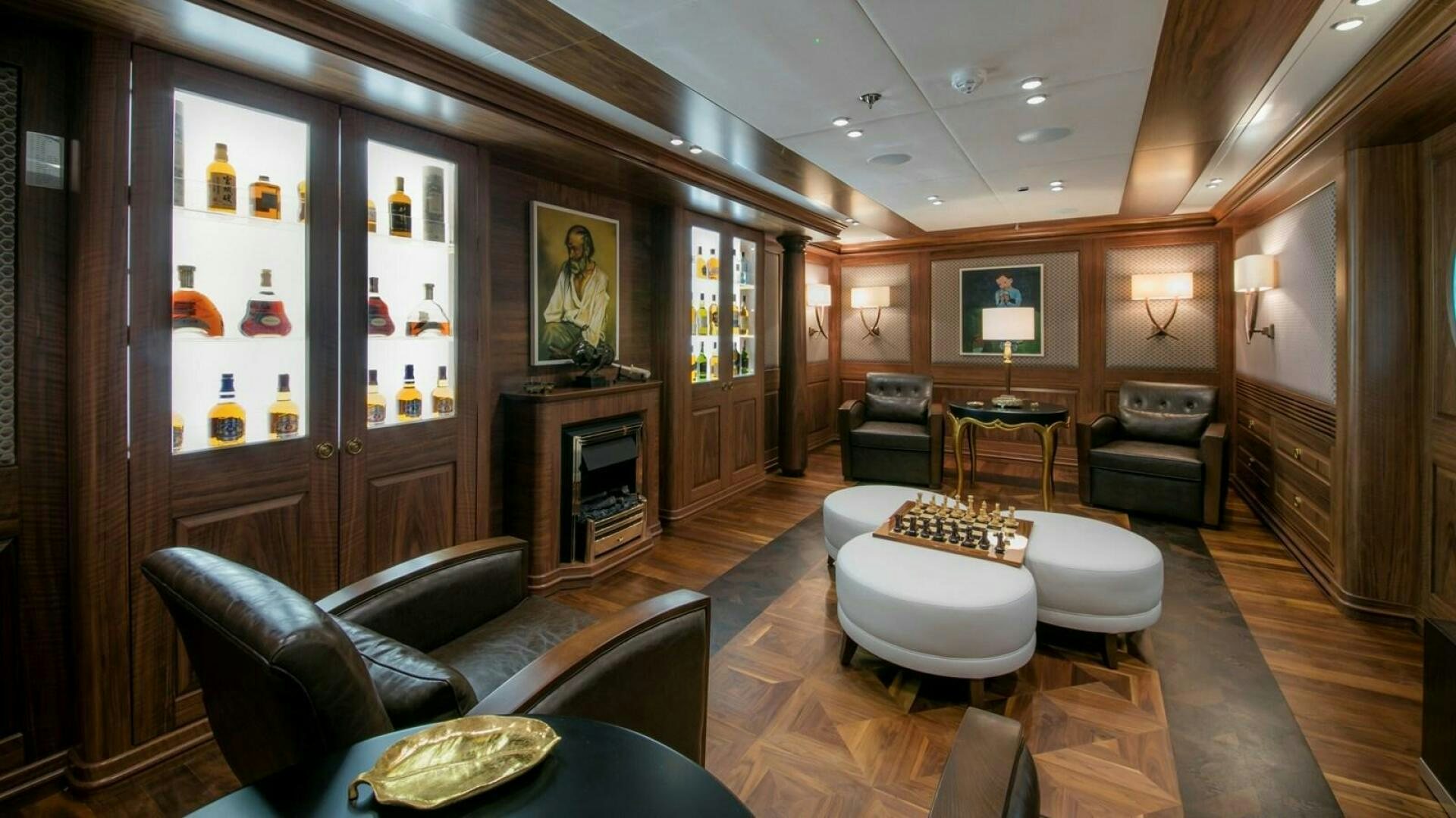 a living room with a fireplace aboard KATINA Yacht for Sale