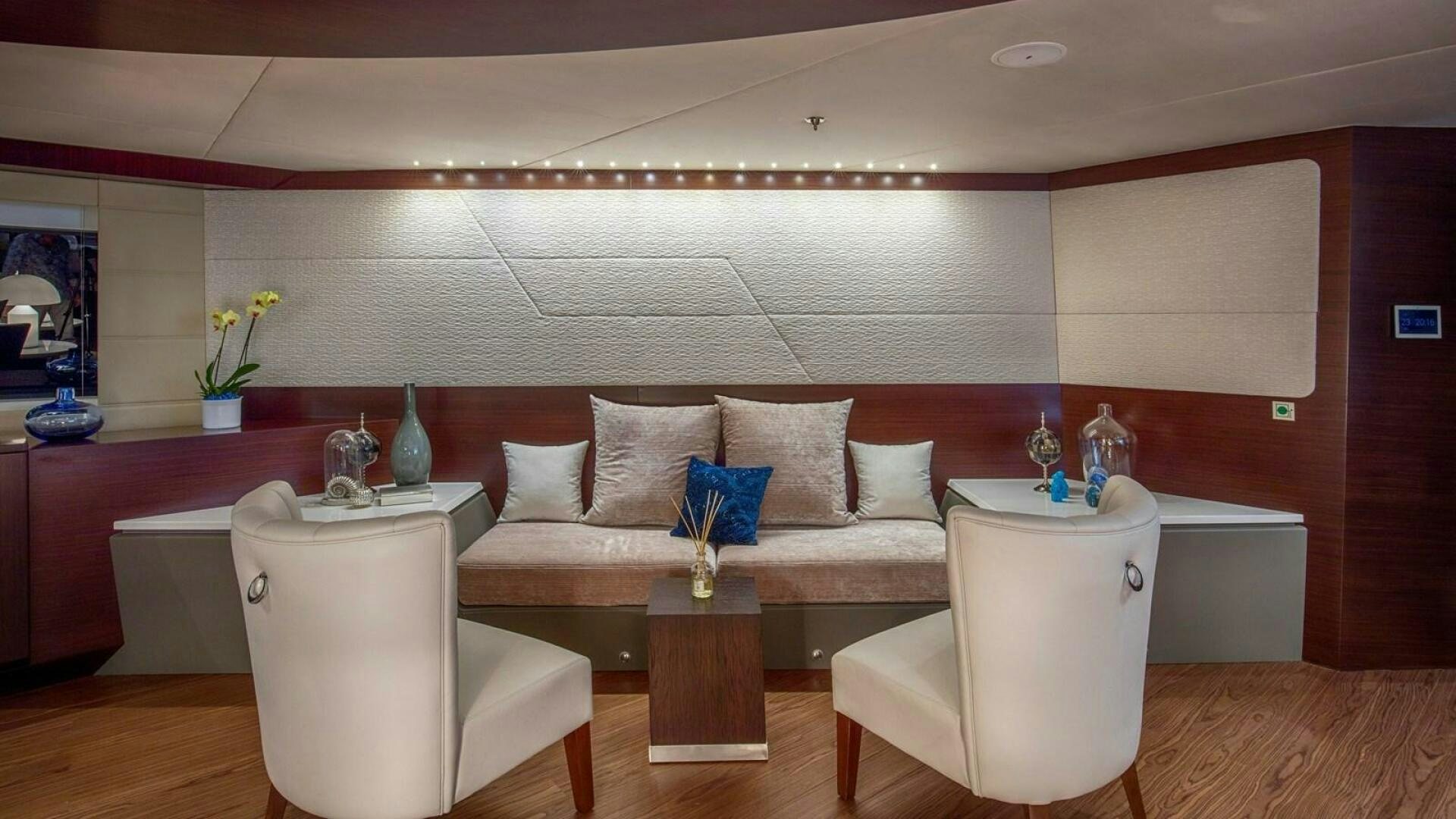 a living room with a couch and a table aboard KATINA Yacht for Sale