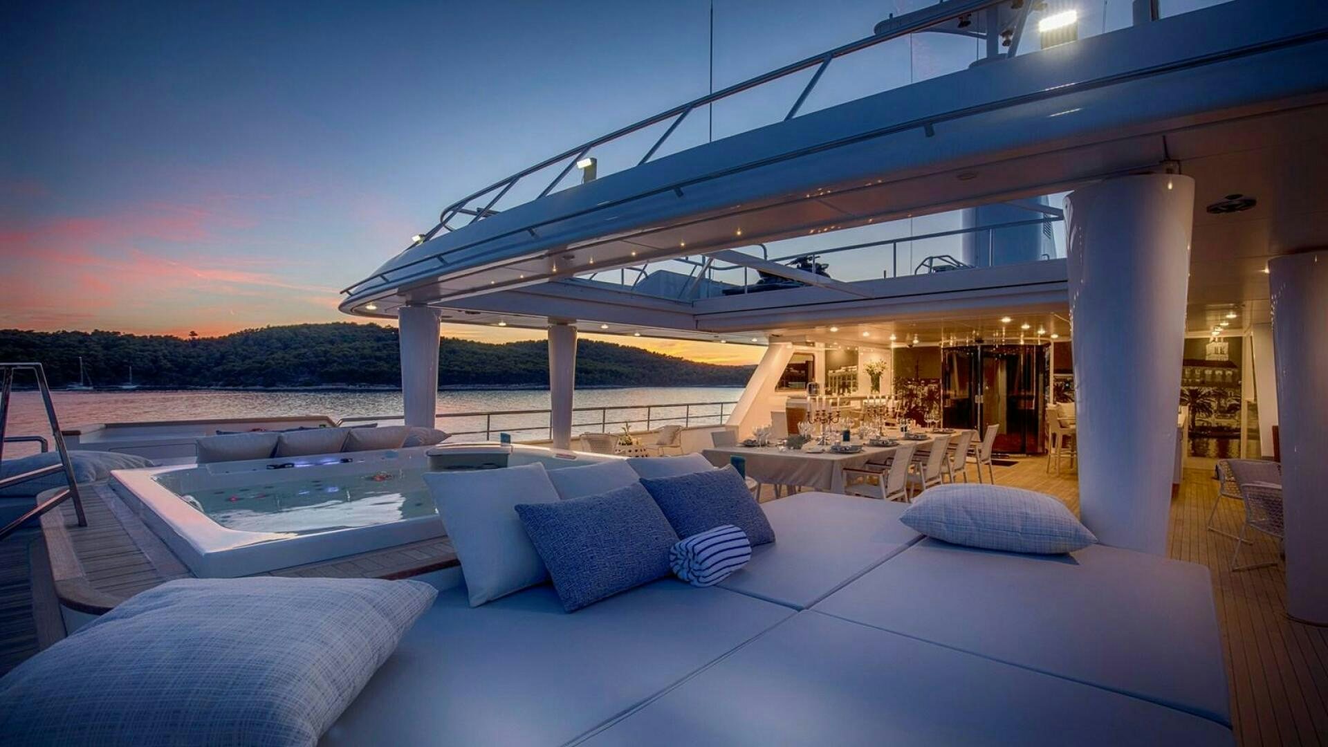 a large white and blue lounge area with a large white patio and a large white building with a aboard KATINA Yacht for Sale