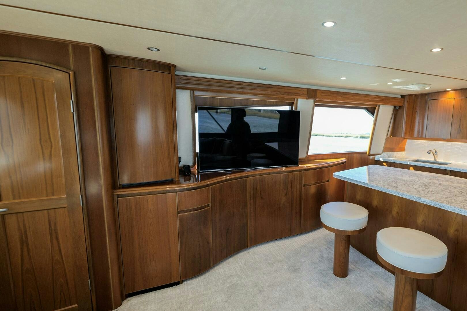 a kitchen with a tv and a table aboard BAILEY'S ARK Yacht for Sale