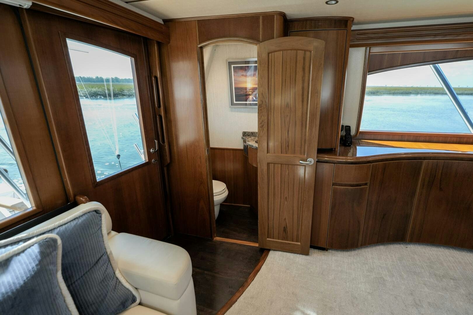 a room with a wood door and a window aboard BAILEY'S ARK Yacht for Sale