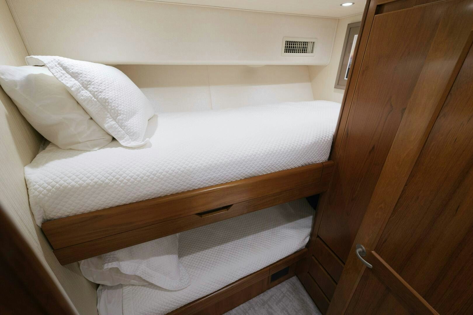 a bed with white sheets aboard BAILEY'S ARK Yacht for Sale