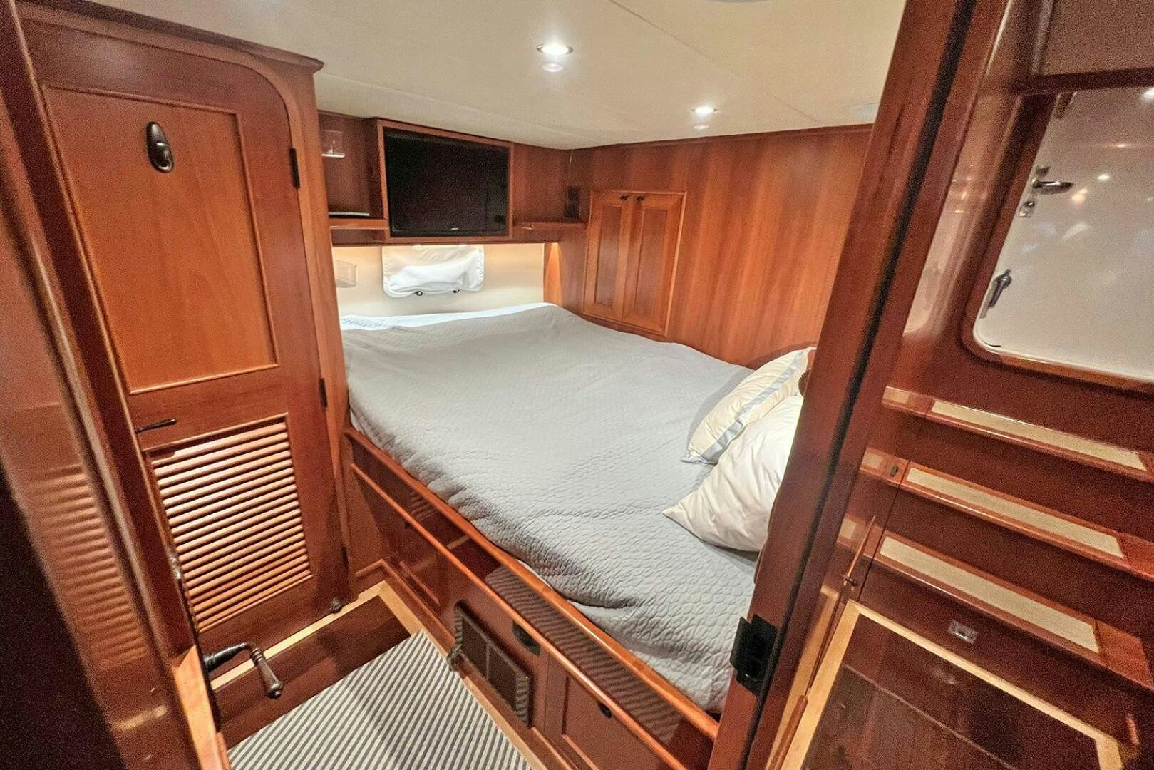 a bed in a room aboard INSIGNIA Yacht for Sale