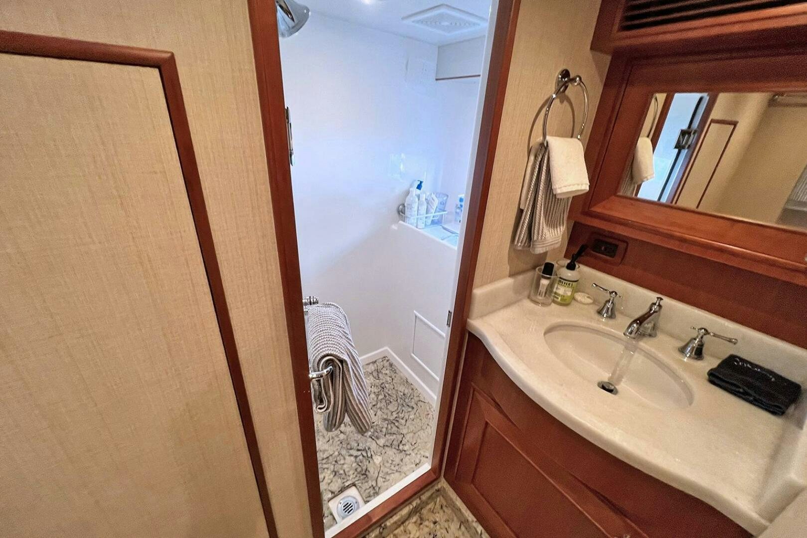 a bathroom with a sink and a mirror aboard INSIGNIA Yacht for Sale