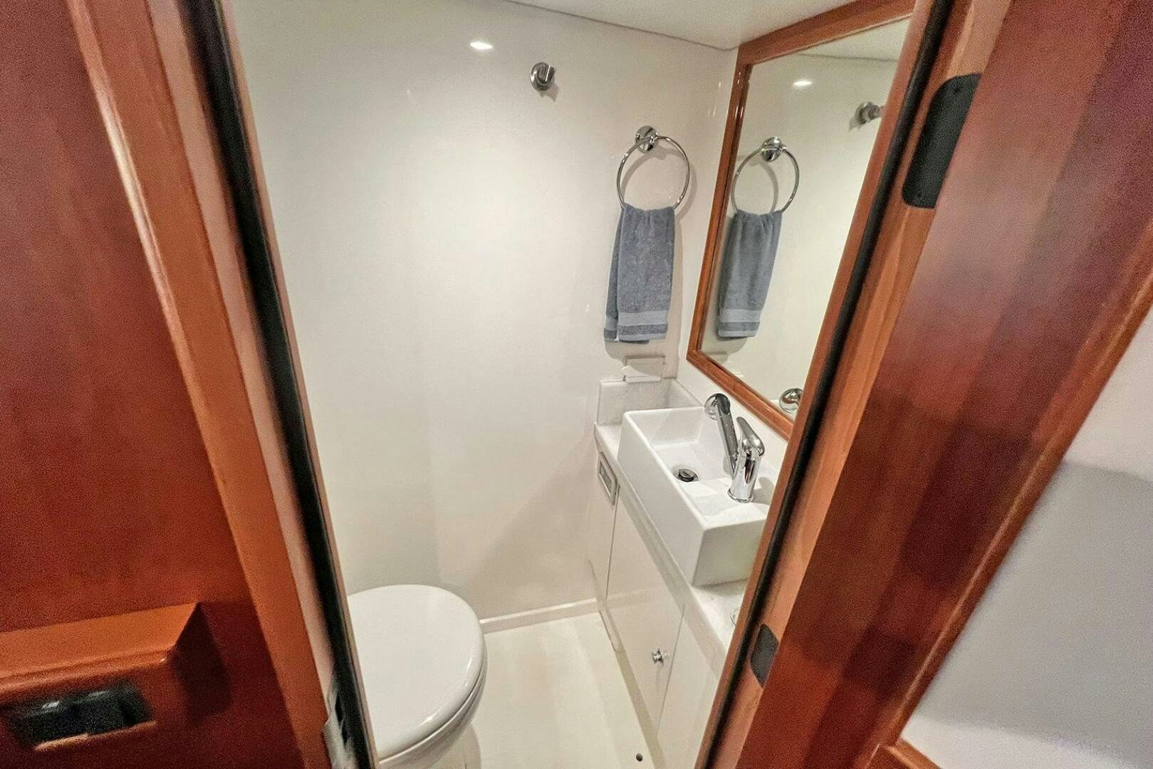 a bathroom with a sink and toilet aboard INSIGNIA Yacht for Sale
