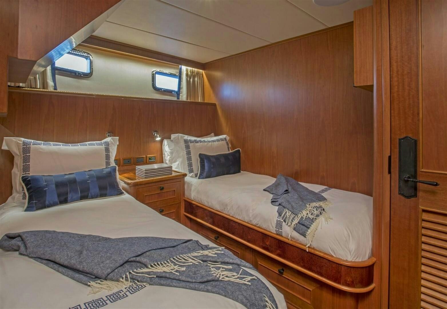 a couple of beds in a room aboard INSIGNIA Yacht for Sale