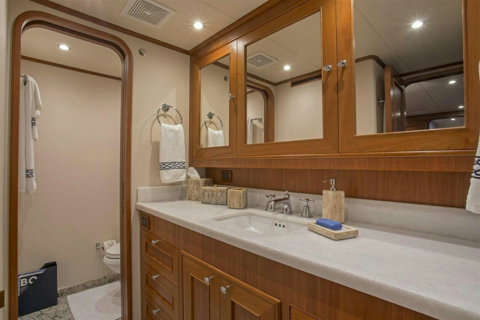 a bathroom with a large mirror aboard INSIGNIA Yacht for Sale