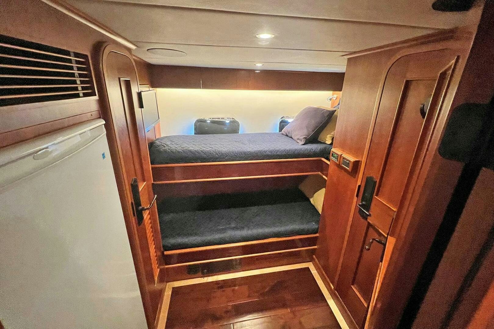 a room with a couch and a door aboard INSIGNIA Yacht for Sale